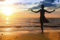 Silhouette of woman practicing yoga during amazing sunset. Royalty Free Stock Photo