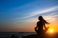 Silhouette of a woman practicing yoga. Fitness and healthy lifestyle Royalty Free Stock Photo