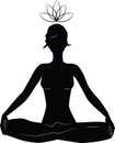 Silhouette of woman practicing yoga in lotus position