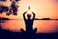 Silhouette woman practicing yoga Royalty Free Stock Photo