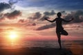 Silhouette woman practicing yoga on the sea beach at amazing bloody sunset. Royalty Free Stock Photo