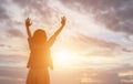 Silhouette of woman praying over beautiful sky background Royalty Free Stock Photo