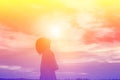 Silhouette of woman praying over beautiful sky background Royalty Free Stock Photo