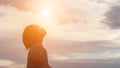 Silhouette of woman praying over beautiful sky background Royalty Free Stock Photo