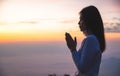 Silhouette of woman  praying over beautiful sunrise background, beautiful landscape, pay homage, spirituality and religion,man Royalty Free Stock Photo