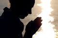Silhouette of woman prays Royalty Free Stock Photo