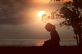 Silhouette of woman read the bible on the beach Royalty Free Stock Photo