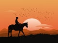 Silhouette of a woman riding a horse on top of a mountain with sunset  background Royalty Free Stock Photo