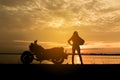 Silhouette woman riding motor bike with sunset Royalty Free Stock Photo