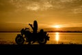 Silhouette woman riding motor bike with sunset. Travel Concept Royalty Free Stock Photo