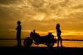 Silhouette woman riding motor bike with sunset. Travel Concept Royalty Free Stock Photo