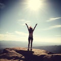 silhouette woman rising hands on mountain in morning with vintage light Royalty Free Stock Photo