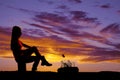 Silhouette woman roasting a marshmallow Royalty Free Stock Photo