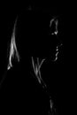 A silhouette of a woman`s face on black background Royalty Free Stock Photo