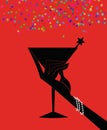 Silhouette of a Woman`s Hand Holding a Cocktail on a Red Backgro