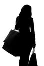 Silhouette of a woman with shopping bags Royalty Free Stock Photo