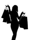 Silhouette of a woman with shopping bags Royalty Free Stock Photo