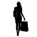 Silhouette of woman with shopping bags Royalty Free Stock Photo