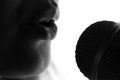 Silhouette of a woman singing with a microphone in hands Royalty Free Stock Photo