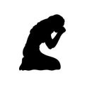 Silhouette of woman sitting on her knees praying