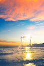 Silhouette woman sitting on a swing set in the sea on the beach at sunset.Koh Kood, Thailand Royalty Free Stock Photo