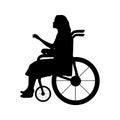 Silhouette woman sitting in wheelchair