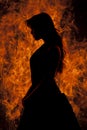 Silhouette woman stand in front of fire Royalty Free Stock Photo