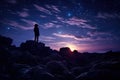 Silhouette of woman standing on the edge of rock and looking at the starry sky, silhouette of a person on rocks looking at the Royalty Free Stock Photo