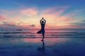 Silhouette of woman standing at yoga pose on the beach Royalty Free Stock Photo