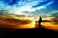 silhouette of woman success on top mountain at sunset, selective Royalty Free Stock Photo