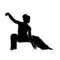 Silhouette of a female fighter doing wushu martial art action pose.