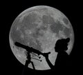 Silhouette of a woman with telescope Moon Observing Royalty Free Stock Photo