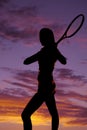 Silhouette woman tennis racquet behind sunset Royalty Free Stock Photo