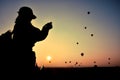 Silhouette woman traveler take photo view sunrise with many hot air balloons above Bagan in Myanmar. Royalty Free Stock Photo