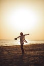 Silhouette of the Woman with Ukulele on the Beach Summer Vacation Royalty Free Stock Photo