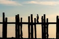 Silhouette of woman walk on U-Bein bridge, Landmark of Mandalay, Myanmar Royalty Free Stock Photo