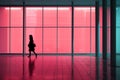 silhouette of a woman walking in an empty building