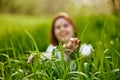 silhouette of a woman walking in tall grass. Photo out of focus Royalty Free Stock Photo