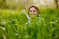 silhouette of a woman walking in tall grass. Photo out of focus Royalty Free Stock Photo