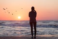 Silhouette of woman watching sunrise Royalty Free Stock Photo