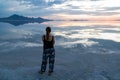 Silhouette of woman watching the sunset at lake Bonneville Salt Flats, Wendover, Western Utah, USA, America. Beautiful summits of Royalty Free Stock Photo