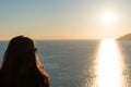 Silhouette of woman is watching sunset over the sea Royalty Free Stock Photo