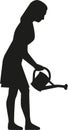 Silhouette of woman watering flowers with can Royalty Free Stock Photo