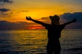 Silhouette women wearing a hat are enjoying a beautiful sunset o Royalty Free Stock Photo