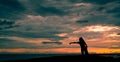 Silhouette woman workout in the morning at stone beach with beautiful sunrise sky. Fit woman runner  stretching body before Royalty Free Stock Photo