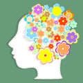 Silhouette womans head filled with cute flowers