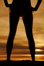 Silhouette of womans legs back hands on hips Royalty Free Stock Photo