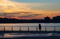 Silhouette of women photographing the sunset in New York City