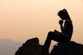 Silhouette of a women is praying to God on the mountain. Praying hands with faith in religion and belief in God on blessing Royalty Free Stock Photo