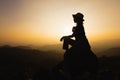 Silhouette of a women is praying to God on the mountain. Praying hands with faith in religion and belief in God on blessing Royalty Free Stock Photo